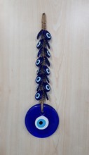 WALL ORNAMENT<br/> WITH PLASTIC(small ones) AND GLASS BEAD<BR/>(42*12CM)
